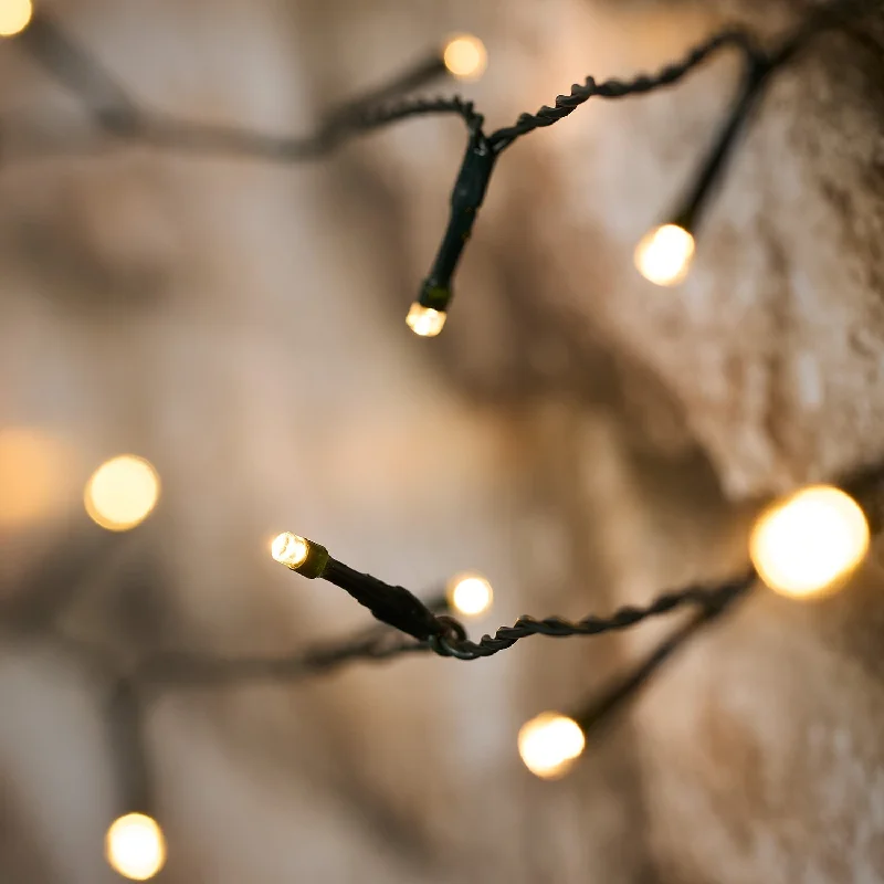 Twinkling String Lights for a Magical Atmosphere50 Warm White LED Solar Lights with USB Rechargeable Solar Panel