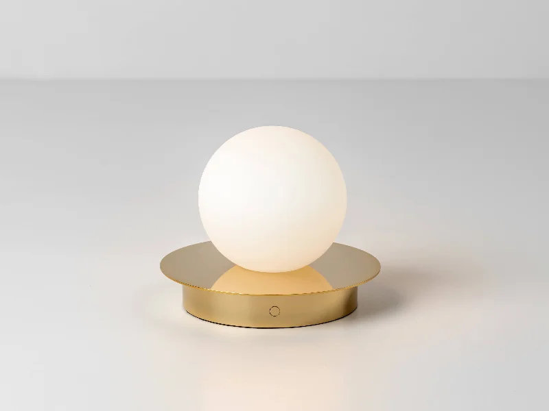 wooden table lamps with natural grain for a warm and organic feelBrass opal disk cordless table lamp