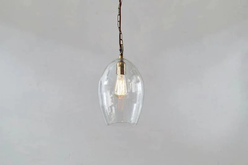 Moroccan Ceiling Lights with Colorful Stained Glass and Geometric CarvingsOtoro Recycled Glass Pendant - Clear - Small Oval Moroccan Ceiling Lights with Colorful Stained Glass and Geometric CarvingsOtoro Recycled Glass Pendant - Clear - Small Oval
