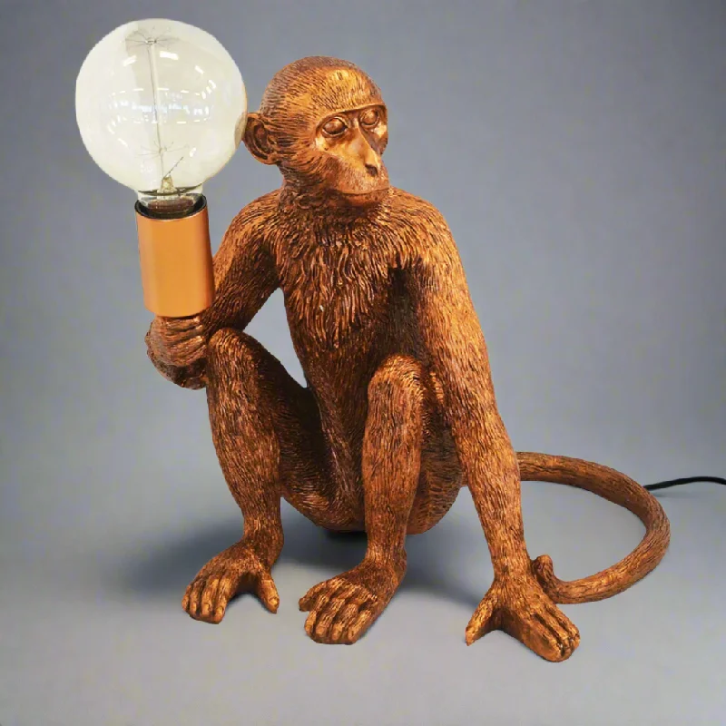 rustic farmhouse table lamps for cozy kitchensResin monkey torch copper
